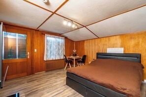 1 bedroom, desk, iron/ironing board, travel crib