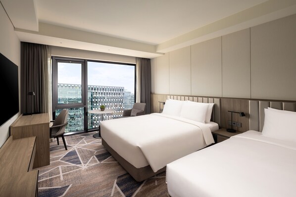 A hotel room with two beds, a desk, a chair, a TV, and a large window with a city view. - Hyatt Place Seoul Pangyo (Seongnam)