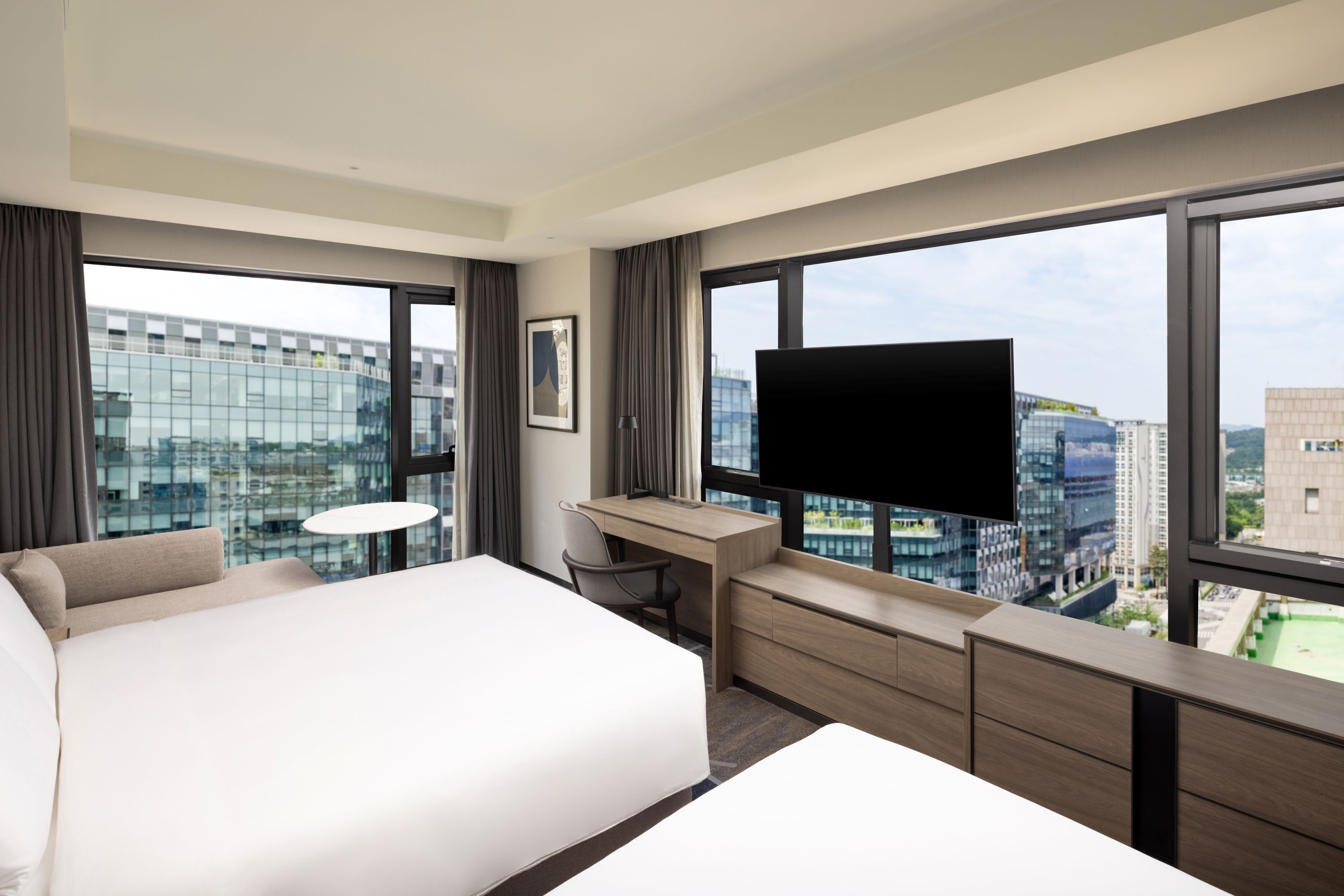 Deluxe Room, Multiple Beds, City View | In-room safe, desk, laptop workspace, blackout curtains