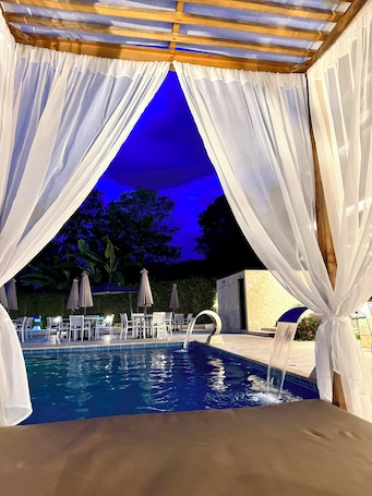 2 outdoor pools, open 9:00 AM to 10:00 PM, free cabanas, pool umbrellas
