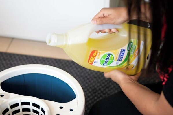 A person holding a large bottle of dish soap. - Vest Suite@ Midhills Genting Highlands (Free WiFi) (Genting Highlands)