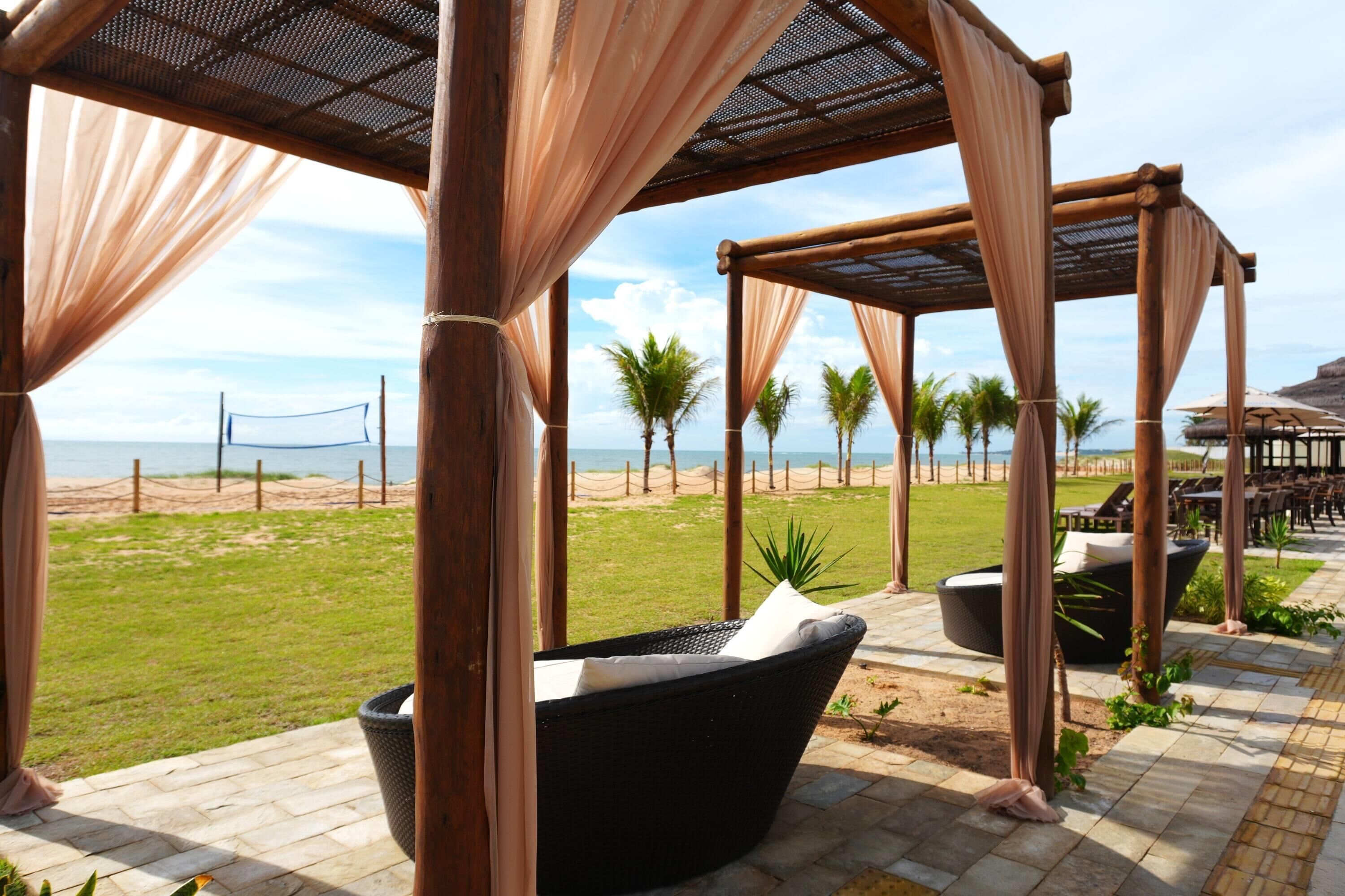 On the beach, white sand, sun loungers, beach umbrellas