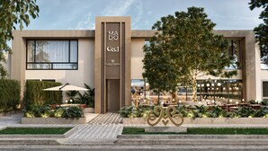 A modern building with a cafe named "MA DO CECI" and "CAGITANA" on the ground floor. - Berthas Collection By EM Hotels (Cartagena)