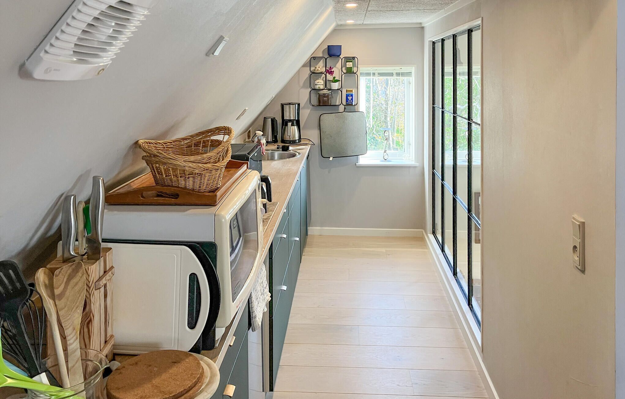 Fridge, stovetop, dishwasher, coffee/tea maker