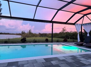 Outdoor pool, a heated pool - NEW The Spectacular Sunrise Lake View, Beautiful Home with Heater Salt pool. (Cape Coral)