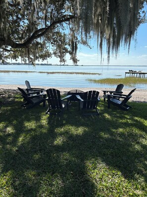 Property grounds - A welcoming lakefront home on a beautiful private beach and long range lake view (Lake Placid)