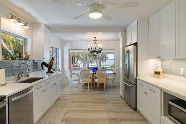Microwave, oven, stovetop, dishwasher - A welcoming lakefront home on a beautiful private beach and long range lake view (Lake Placid)