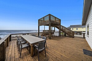 Outdoor dining - Beachfront Getaway: Fire Pit, Game Room & Views (Surfside)