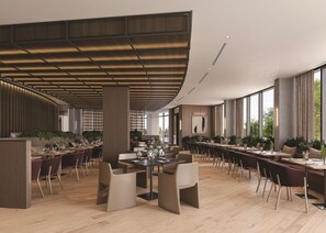 A modern dining area with long tables, chairs, and potted plants. - The Clayfield, in the Unbound Collection by Hyatt (Niagara-on-the-Lake)