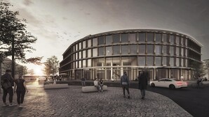A modern building with a curved facade, a restaurant sign, and a paved area with people and cars. - The Clayfield, in the Unbound Collection by Hyatt (Niagara-on-the-Lake)