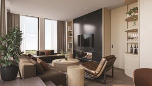 A modern living room with a fireplace, comfortable seating, and a flat-screen TV. - The Clayfield, in the Unbound Collection by Hyatt (Niagara-on-the-Lake)