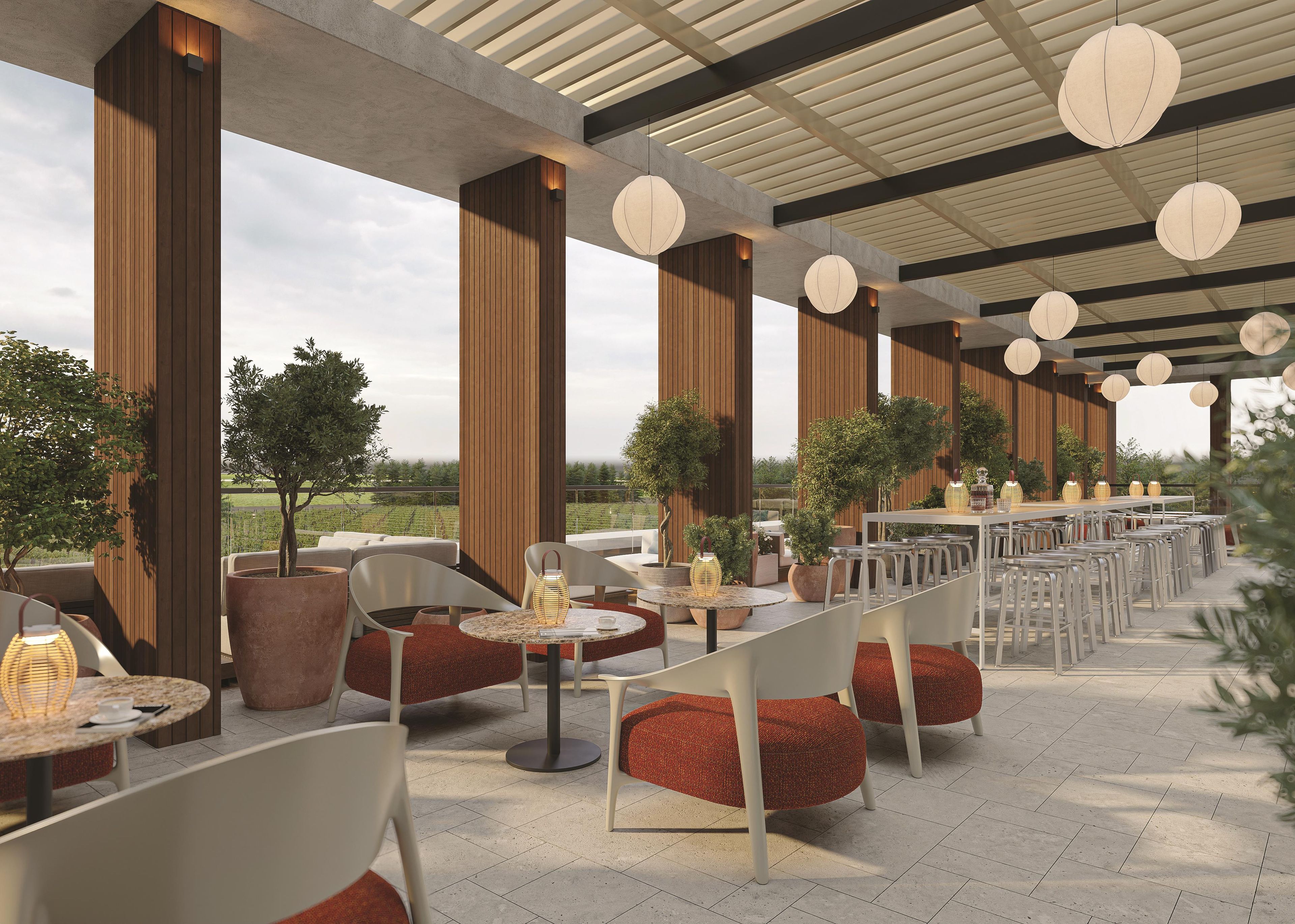 An outdoor dining area with multiple tables and chairs, large wooden columns, and hanging lanterns.