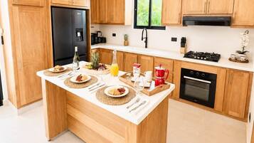 Coffee/tea maker, fridge, microwave, oven