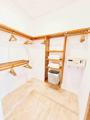 A corner room with a wooden wardrobe, a drying rack, and a built-in heater. - Sleeps up to 40 |8BR, Mini Golf & Largest Pool SOV (Sosúa)