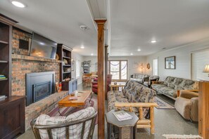 TV, fireplace, books