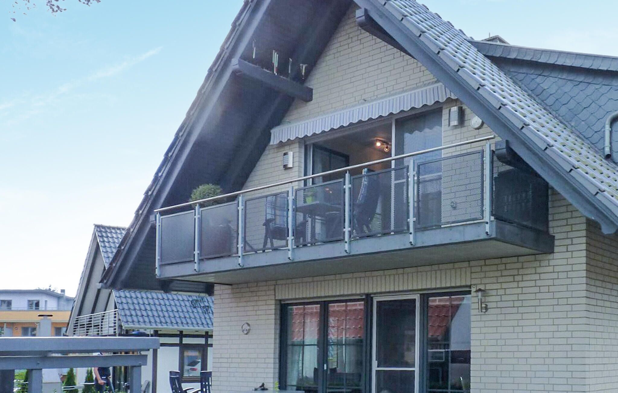 A two-story house with a balcony.
