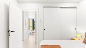 A modern bedroom with a bed, a nightstand, and a lamp. - D432 Very beautiful apartment with a balcony (Cole Bay)