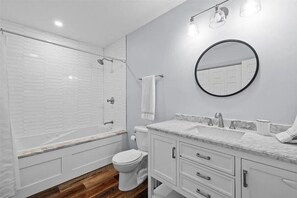 Shower, jetted tub, hair dryer, towels