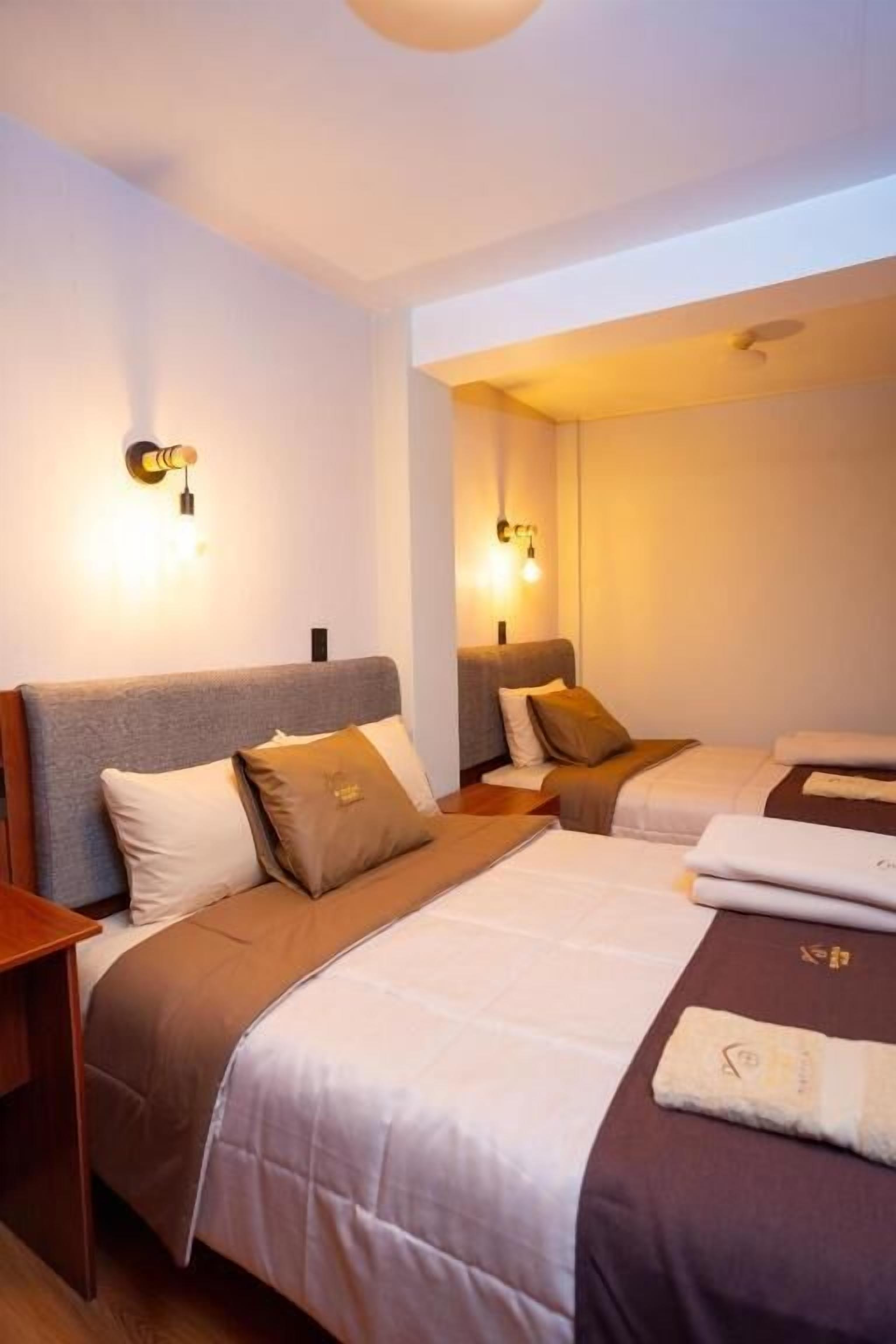 Family Apartment | Desk, laptop workspace, blackout drapes, iron/ironing board