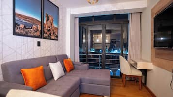 Family Apartment, Private Bathroom, City View | Desk, laptop workspace, blackout drapes, iron/ironing board