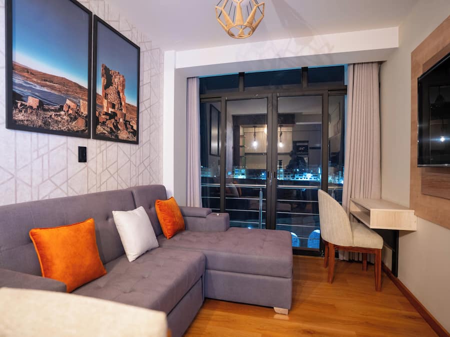 Family Apartment, Private Bathroom, City View | Desk, laptop workspace, iron/ironing board, free WiFi