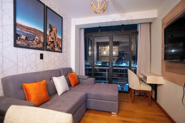 Family Apartment, Private Bathroom, City View | Desk, laptop workspace, blackout drapes, iron/ironing board