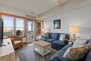 TV, books - C202 - OBX Dream: Cozy 2BR condo in Nags Head with soundfront views. (Nags Head)