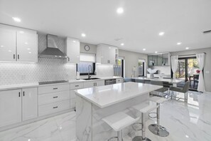 Fridge, microwave, oven, stovetop - Sleek 4BR Beach House • Pool, Spa & Near Beach (Naples)