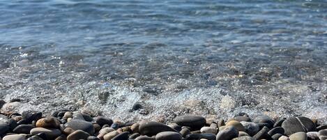 On the beach, sun loungers, beach towels