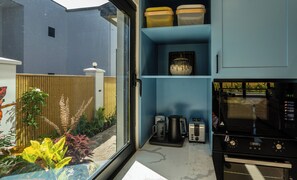 Deluxe Duplex, 3 Bedrooms, Kitchen, Pool View | Private kitchen | Full-size fridge, microwave, oven, stovetop - Tides Apartments (Nadi)