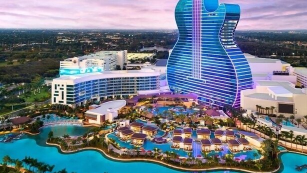 A resort with a large building shaped like a guitar, multiple swimming pools, and a variety of resort buildings. - Private Chic Studio with Patio • King Bed • Near Beach (Hollywood)