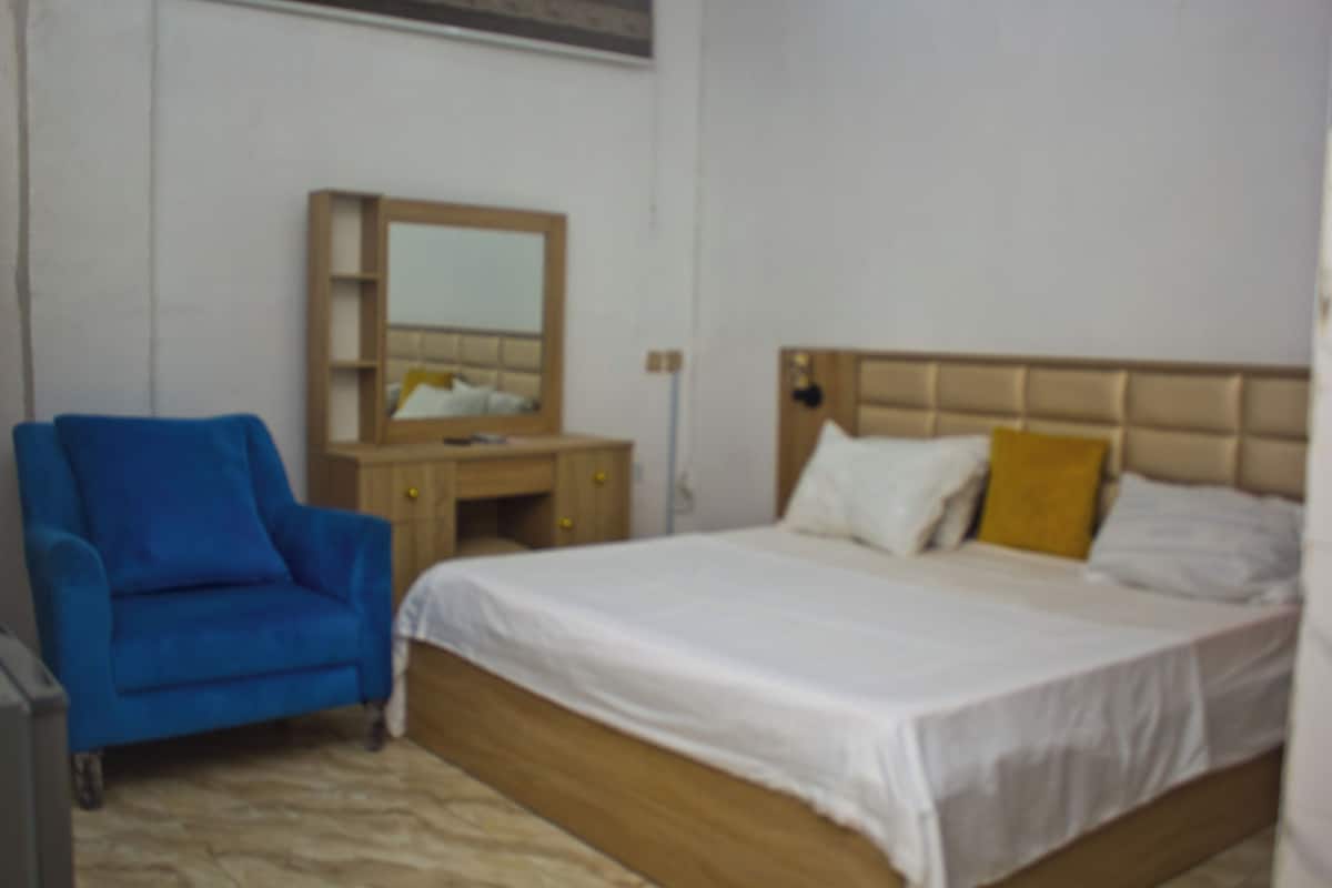 Premium bedding, pillow-top beds, desk, laptop workspace