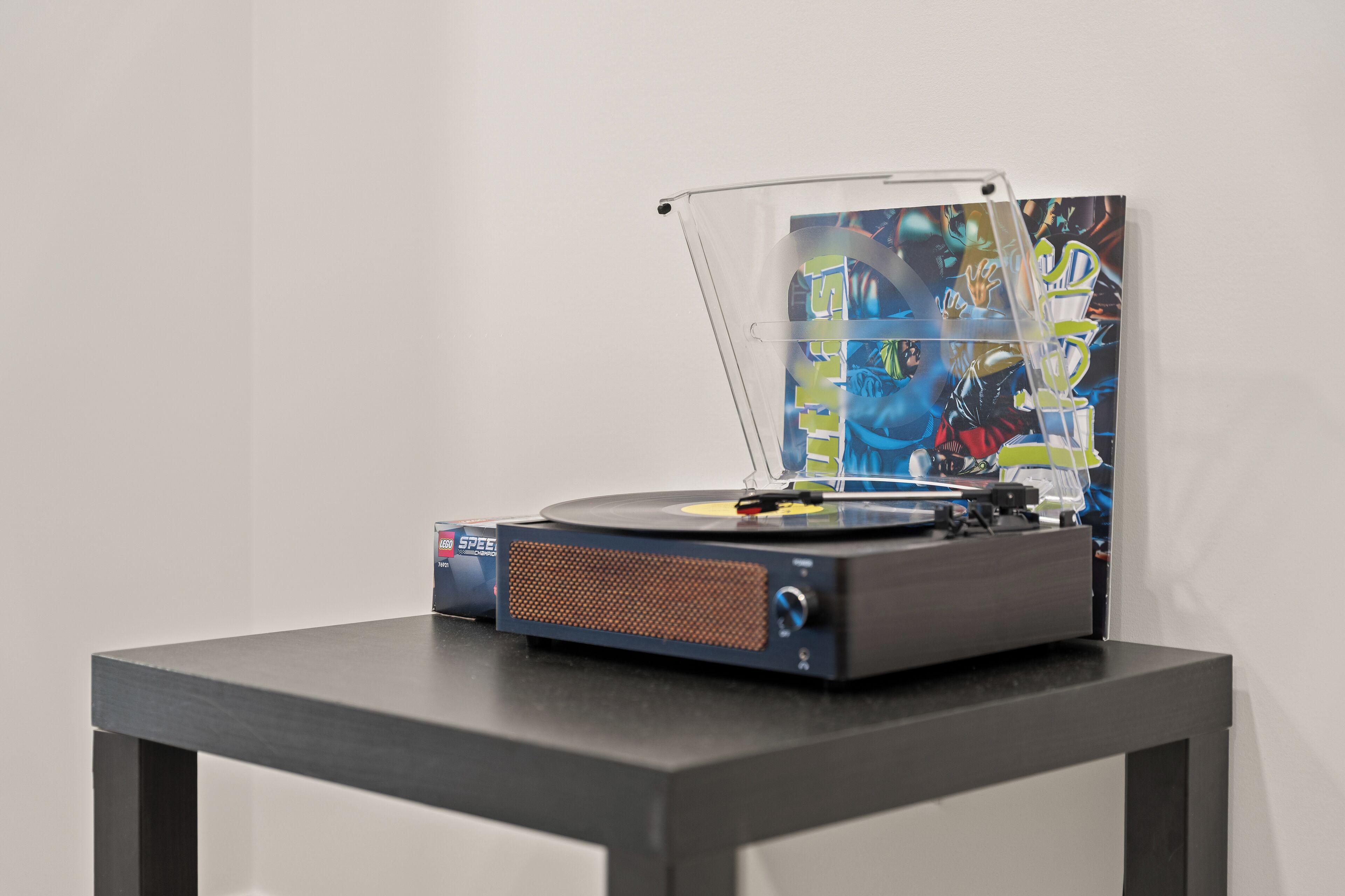 A turntable with a record player on a table.