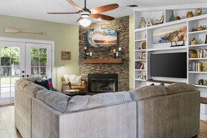 TV, fireplace, books