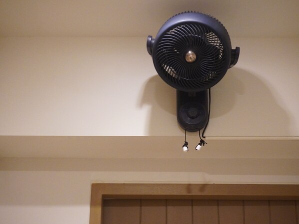 A wall-mounted fan with a pull cord and two power outlets. - Trybe Capsule Hostel Chiang Mai (Chiang Mai)