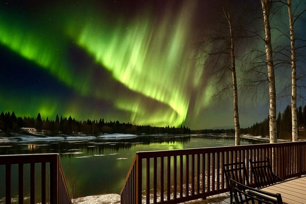 Amazing aurora by the river