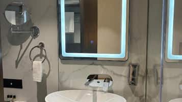 Shower, hair dryer, slippers, towels