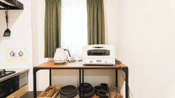 Fridge, microwave, cookware/dishes/utensils