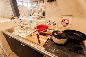 Fridge, microwave, cookware/dishes/utensils