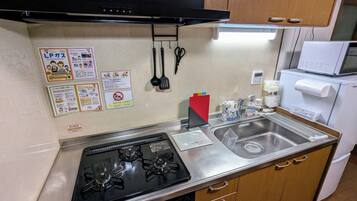 Fridge, microwave, cookware/dishes/utensils