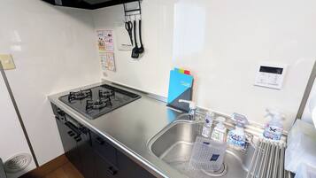 Fridge, microwave, cookware/dishes/utensils