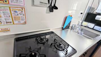 Fridge, microwave, cookware/dishes/utensils