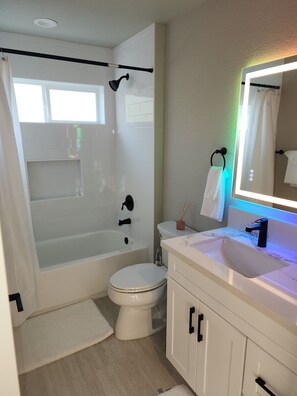 Shower, towels, soap, toilet paper