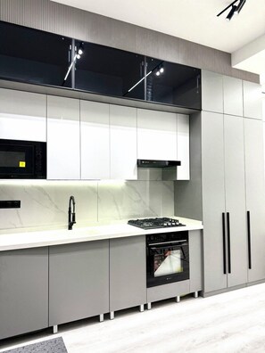 Comfort Apartment, Multiple Beds, City View | Private kitchen | Electric kettle - Kamolon 43a (Tashkent)