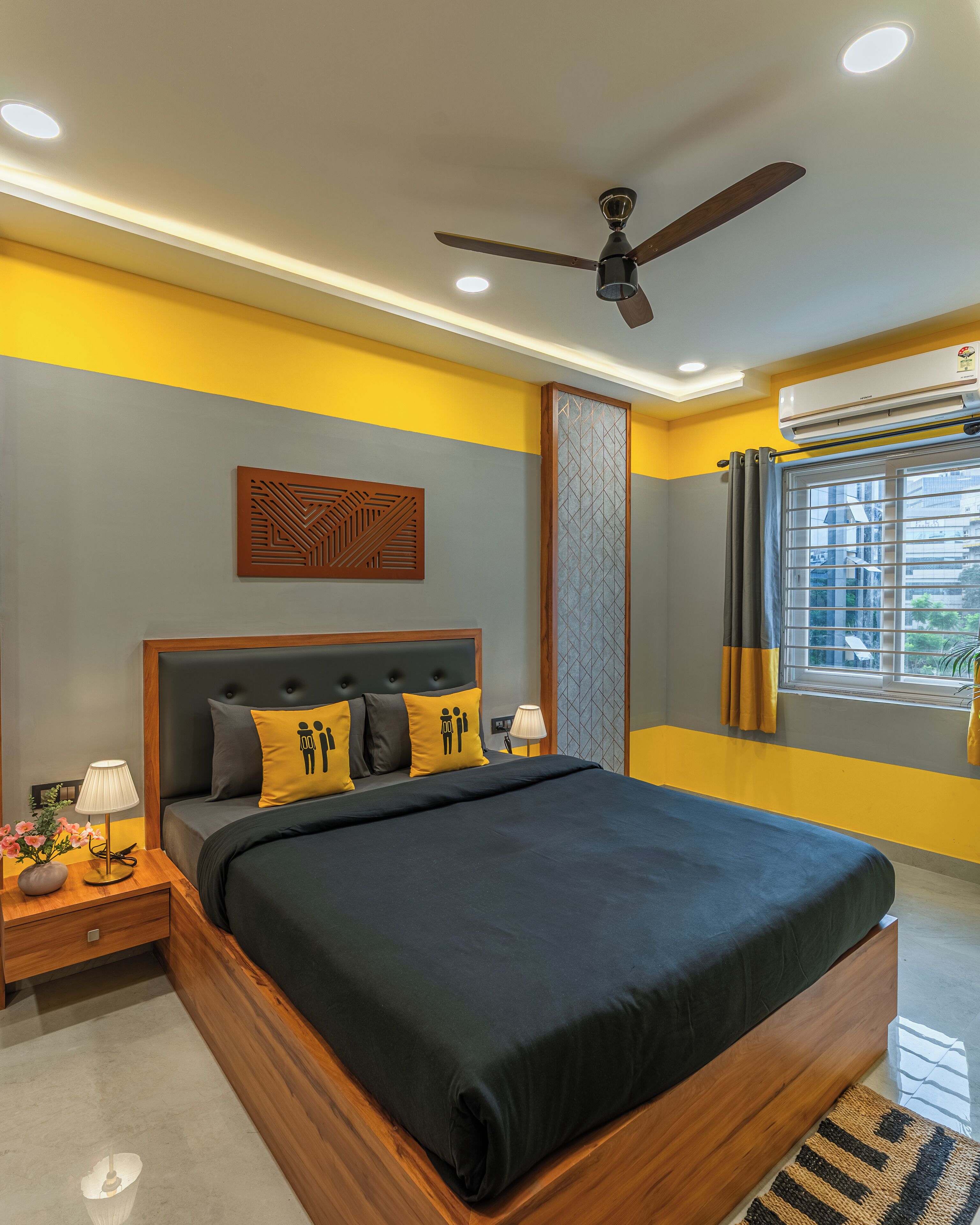 A modern bedroom with a bed, nightstands, a ceiling fan, and a window with curtains.