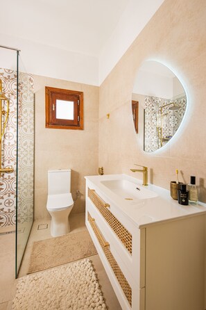 Shower, hair dryer, towels, soap