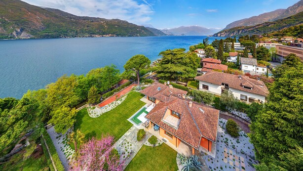 A residential area with a large lake, terraced houses, and a well-maintained garden. - Lakefront Serenity Villa With Pool (Mandello del Lario)