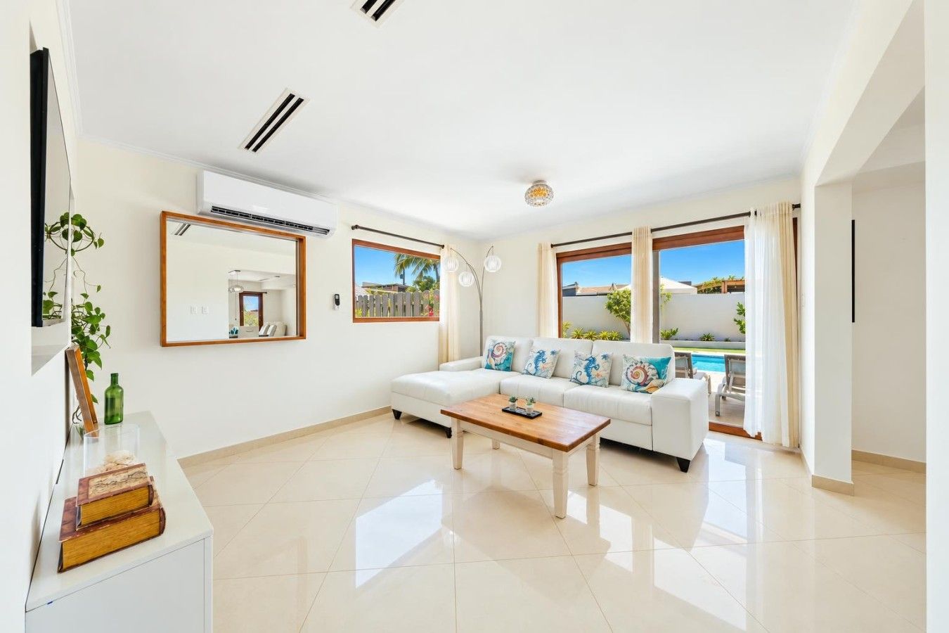 Inside, you’ll find a bright, comfortable open-plan living space with air conditioning, fast Wi-Fi and plenty of room to relax after a day at the beach.