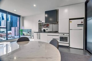 Fridge, microwave, oven, stovetop - The Outlook 2BR City View on Bourke (Melbourne)