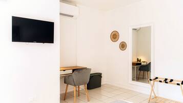 Deluxe Room, Patio | Down duvets, iron/ironing board, free WiFi